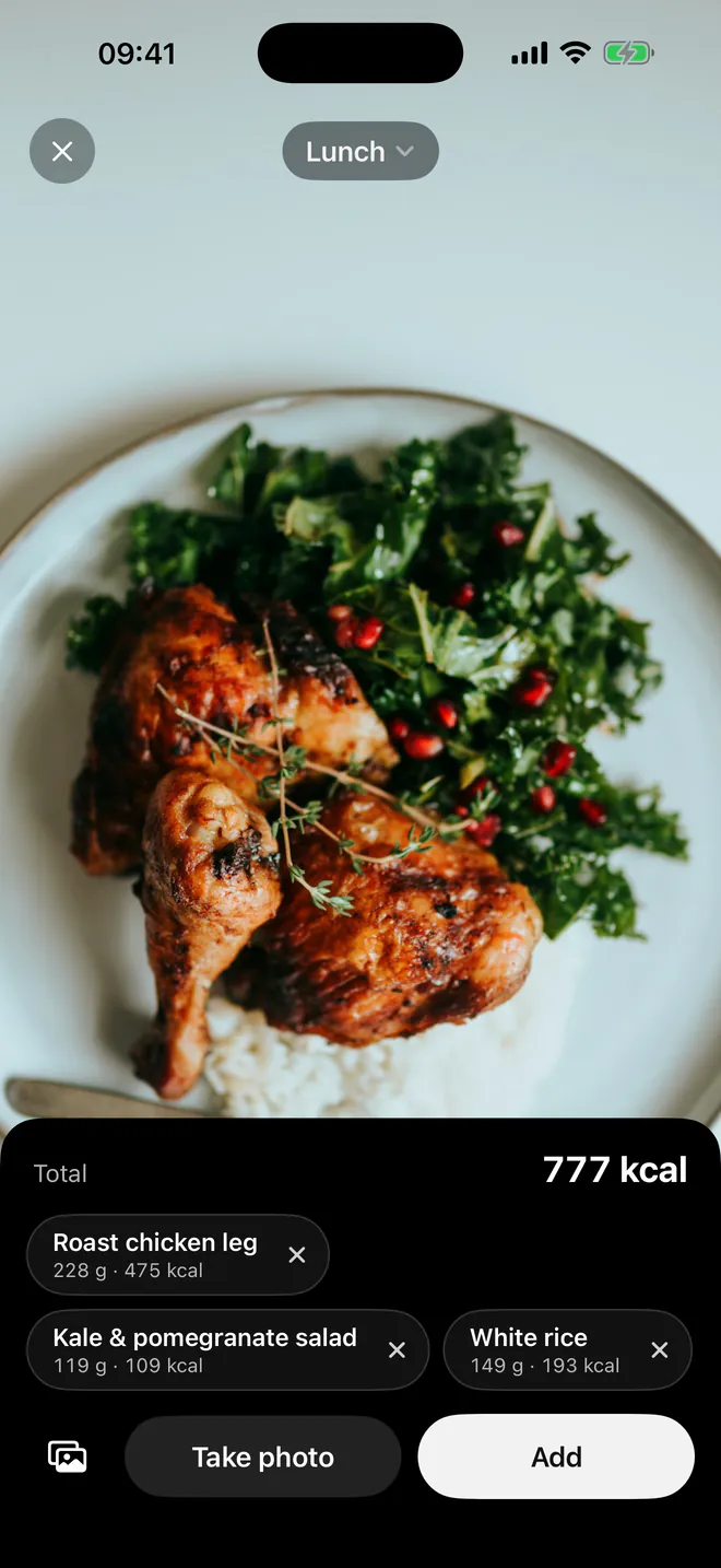 Portiva live scan of a lunch plate: roast chicken leg, 475 kcal; kale and pomegranate salad, 109 kcal; white rice, 193 kcal. Total 777 kcal, with Take photo and Add buttons.